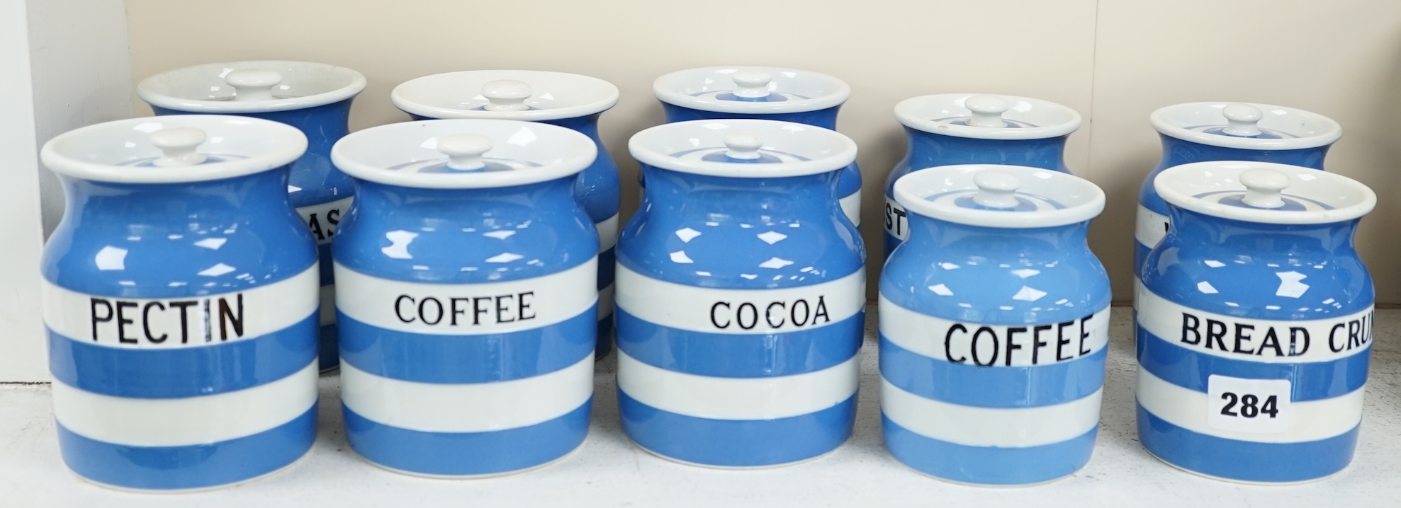T.G.Green Cornish Kitchenware, ten 12cm and 11cm lidded storage jars to include Pectin, Split Peas, Sesame, Custard Powder and Walnuts, Black Shield marks. Condition - fair to good